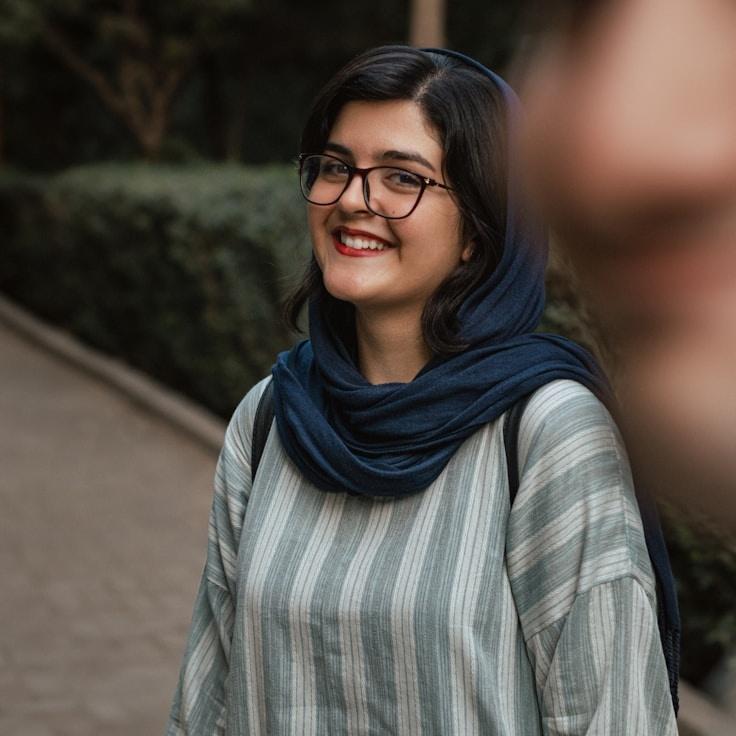 Anya Kapoor, Lead Design Curator at FreshPublisherCanyon, reviewing corporate floral arrangements